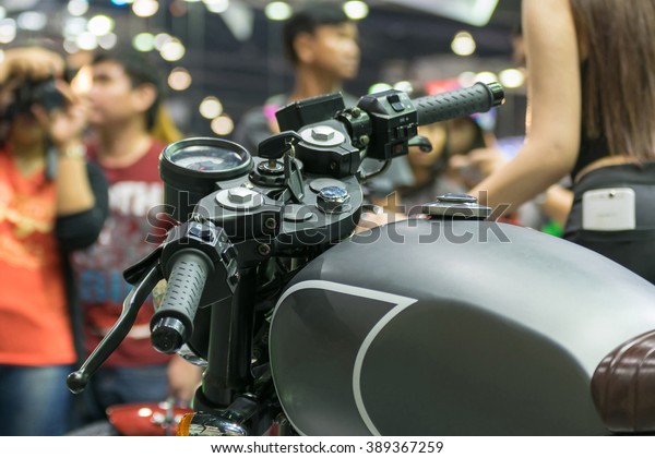 Zoom at motorcycle oil tank and handlebar in\
Car show event at Bangkok, Thailand. This a open event no need\
press credentials\
required.