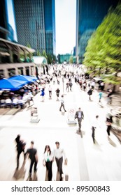 Zoom On Business People Rushing Around At Canary Wharf, London. Motion Blur.