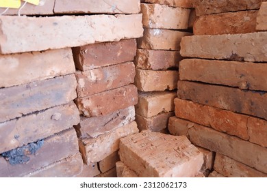 zoom photo of red bricks, materials for making walls in a building. - Shutterstock ID 2312062173