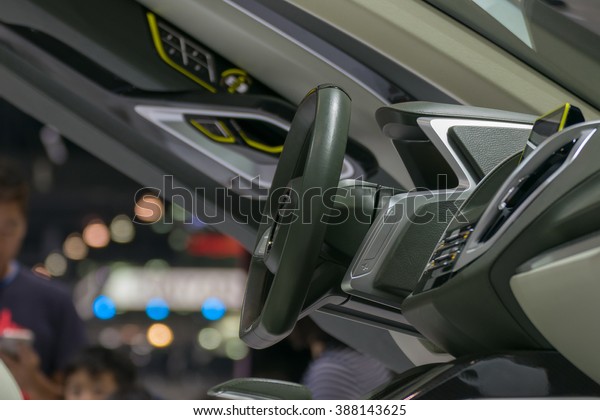 Zoom at sports car console with steering wheel\
in Car show event at Bangkok, Thailand. This a open event no need\
press credentials\
required.