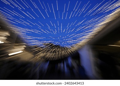 Zoomed in glowing led string lights in dusk sky
