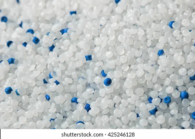 zoomed white and blue polyethylene pellets for production plastic bags