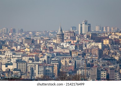 Zoomed-in view of the Galata Tower, located in Beyoglu, Istanbul, with its surrounding structures and its background view, Turkey on Mach 28, 2022.