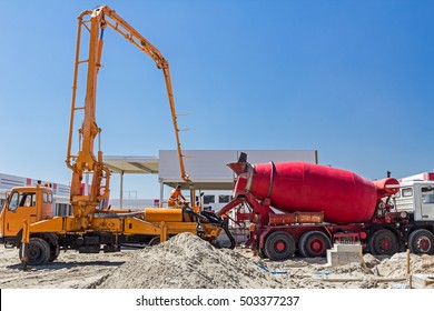 Zrenjanin, Vojvodina, Serbia - August 1, 2015: Truck mixer is pouring concrete into concrete pump for casting.