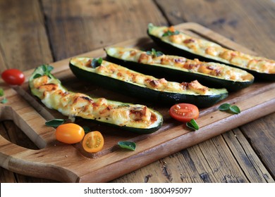 zucchini boats arranged on wooden board - Powered by Shutterstock