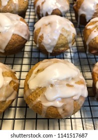 Zucchini Carrot And Applesauce Muffins With White Frosting Or Glaze On Baking Rack, Just Baked Fresh And Homemade Healthy Breakfast Recipe Or Menu Item