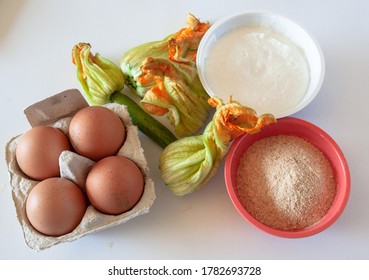 Zucchini Flower Recipe Ingredients With Cottage Cheese On White Background, Natural Light