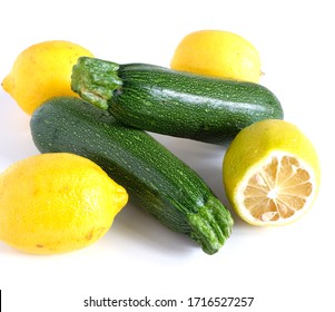 zucchini and lemons on a white background. Vitamins Vegetables.