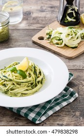 Zucchini Noodles With Pesto Sauce On Wooden Table

