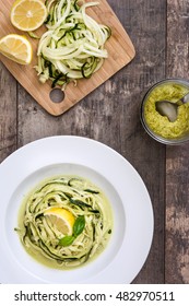 Zucchini Noodles With Pesto Sauce On Wooden Table Background

