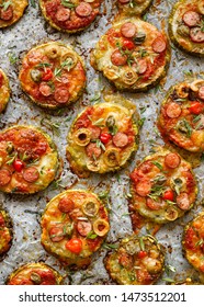 Zucchini Pizza Bites, Grilled Zucchini Slices With Addition Of Mozzarella Cheese, Sausage, Green Olives, Capers And Herbs On White Baking Paper, Top View. Delicious Appetizer Or Breakfast