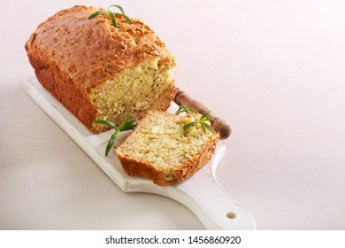 Zucchini, rosemary and cheese savory bread on board