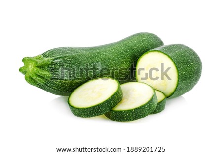 zucchini with slice isolated on white background