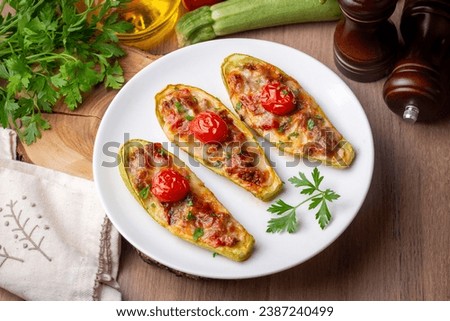Zucchini stuffed with meat, vegetables and cheese. Zucchini boats. Turkish name; kabak sandal