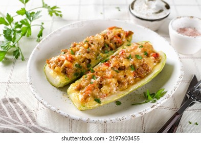 Zucchini stuffed with minced meat and tomatoes and cheese. Baked in the oven. - Shutterstock ID 2197603455