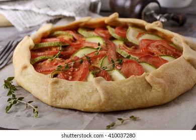 Zucchini And Tomato Galette Open Rustic Pie. Selective Focus
