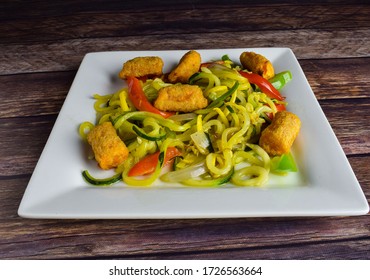 Zucchini And Yellow Squash Spaghertti Top Withbrocolli Tater Tots,