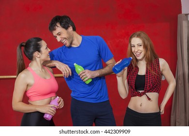 Zumba Dancers Holding Water Bottles In Gym