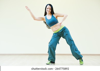 Zumba Firness Instructor Doing Dancing Exercises In Sport Club