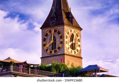 Zurich Cityscape In The Golden Hour. The View Of The Iconic “Clock Tower” Of Zurich With A Rooftop Party. The Shot Was Taken On 21.06.2019