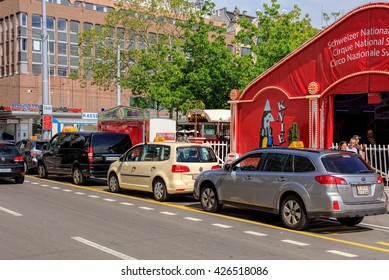 Zurich, Switzerland - 25 May, 2016: taxi cars parked at Sechselautenplatz square, Circus Knie tents in the background. Zurich is the largest city in Switzerland and the capital of the canton of Zurich