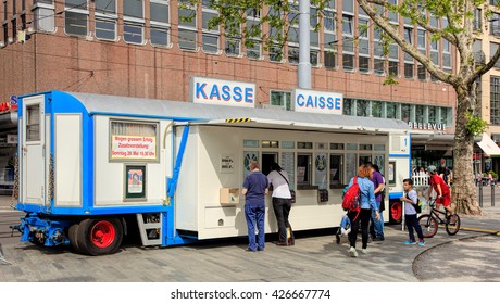 Zurich, Switzerland - 25 May, 2016: people at the trailer serving as cashier's desk of Circus Knie temporarily installed on Sechselautenplatz square. Circus Knie is the largest circus in Switzerland.
