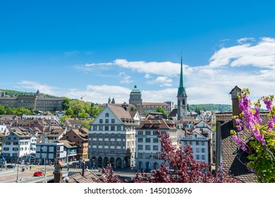 Zurich, Switzerland- April 28, 2018: Beautiful houses and buildings located at the bank of Limmat River at the old town of Zurich, view from Lindenhof hill 