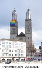 Zurich, Switzerland - January 18, 2020: LGBT Rainbow Pride Flag Is Hung On The Top Of Grossmünster Church.