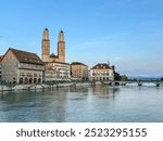 Zurich, Switzerland - July 26, 2024: The waterfront and old town at the mouth of the Limmat Riverl in Zurich Switzerland
