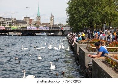 Zurich, Switzerland - May 20, 2015 : People Relax On The Lake Side Park Of Lake Zurich