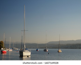 Zurich, Switzerland - Oct 31, 2017: Taken From The Quay (Quaianlagen), Leisure Boats On Lake Zurich / Zürichsee At Sunset At The End Of A Calm, Cloudless Day In Autumn