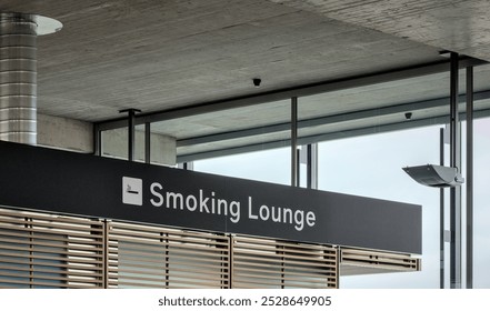 Zurich, Switzerland - Oct 6, 2024: Smoking Lounge inside terminal of Zurich International Airport for travelers to smoke cigarettes. - Powered by Shutterstock