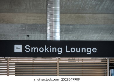 Zurich, Switzerland - Oct 6, 2024: Smoking Lounge inside terminal of Zurich International Airport for travelers to smoke cigarettes. - Powered by Shutterstock