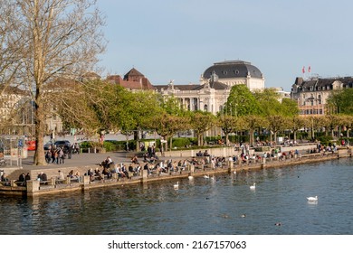 Zurich, Switzerland On April 07, 2014. Lake Zurich, People Sitting On The Sidewalk.