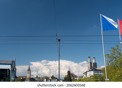 Zurich, Switzerland, September 4, 2021 Massive Cumulus Cloud Behind The City Silhouette On A Sunny Day