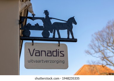 Zutphen, The Netherlands - March 2021: Vintage Old Fashioned Facade Sign With Horse And Carriage On Exterior Of Funeral Home. TRANSLATION: 'VANADIS. FUNERAL ARRANGEMENTS'