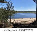 ZWIERZYNIEC, POLAND - MAY, 04, 2024: Echo Ponds Near Zwierzyniec in Roztocze, Known Also as "Stawy Echo", View of a Pond With a Beach Surrounded by Forest