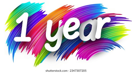 1 year paper word sign with colorful spectrum paint brush strokes over white. Vector illustration.