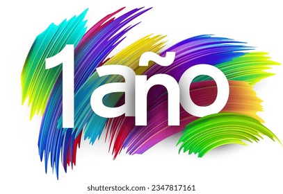 1 year at spanish paper word sign with colorful spectrum paint brush strokes over white. Vector illustration.