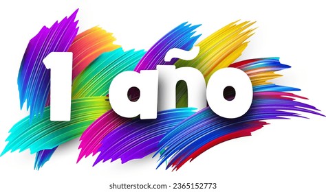 1 year at spanish paper word sign with colorful spectrum paint brush strokes over white. Vector illustration.