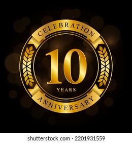 10 Year Anniversary celebration template design, with shiny ring and gold ribbon, laurel wreath isolated on black background, logo vector