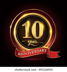 10 years celebration anniversary logo with golden ring and red ribbon.