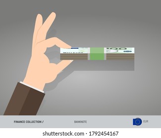 100 Euro banknotes. A bundle of money in hand. Flat style vector illustration.