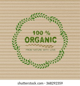 100% organic sign with green leaves. Organic harvest stamp. Fresh farm logo. Organic store. Cardboard vector backgraund.