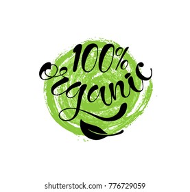 100% organic text lettering with leaf on circle painted spot label. Vector illustration. 