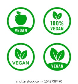 100% vegan food diet icon set. Organic, bio, eco symbols. Vegan, no meat, lactose free, healthy, nonviolent food. Round green vector illustrations with leaves and apple for stickers, labels and logos