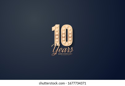 10th anniversary background with black background illustrations and gold figures.