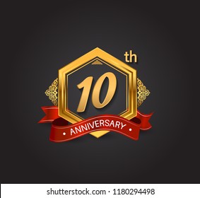 10th anniversary design logotype style with golden hexagon, ornament and red ribbon for use in celebration event.