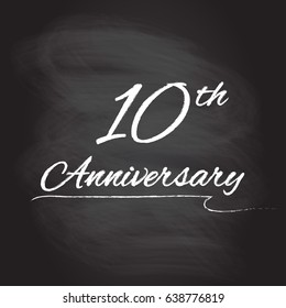 10th anniversary emblem hand drawn by chalk. 10 years celebration isolated on blackboard background. Vector illustration.