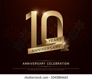 10th years anniversary celebration gold number and golden ribbons with fireworks on dark background. vector illustration